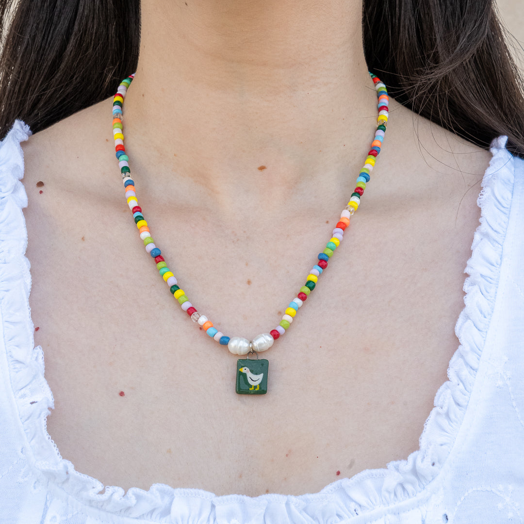 Collana di perline colorate con ciondolo paperella