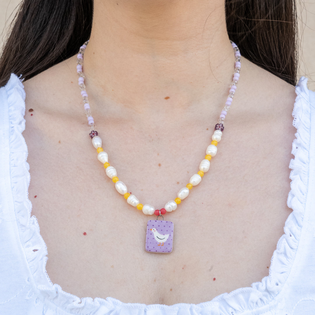 Collana con perle e ciondolo paperella