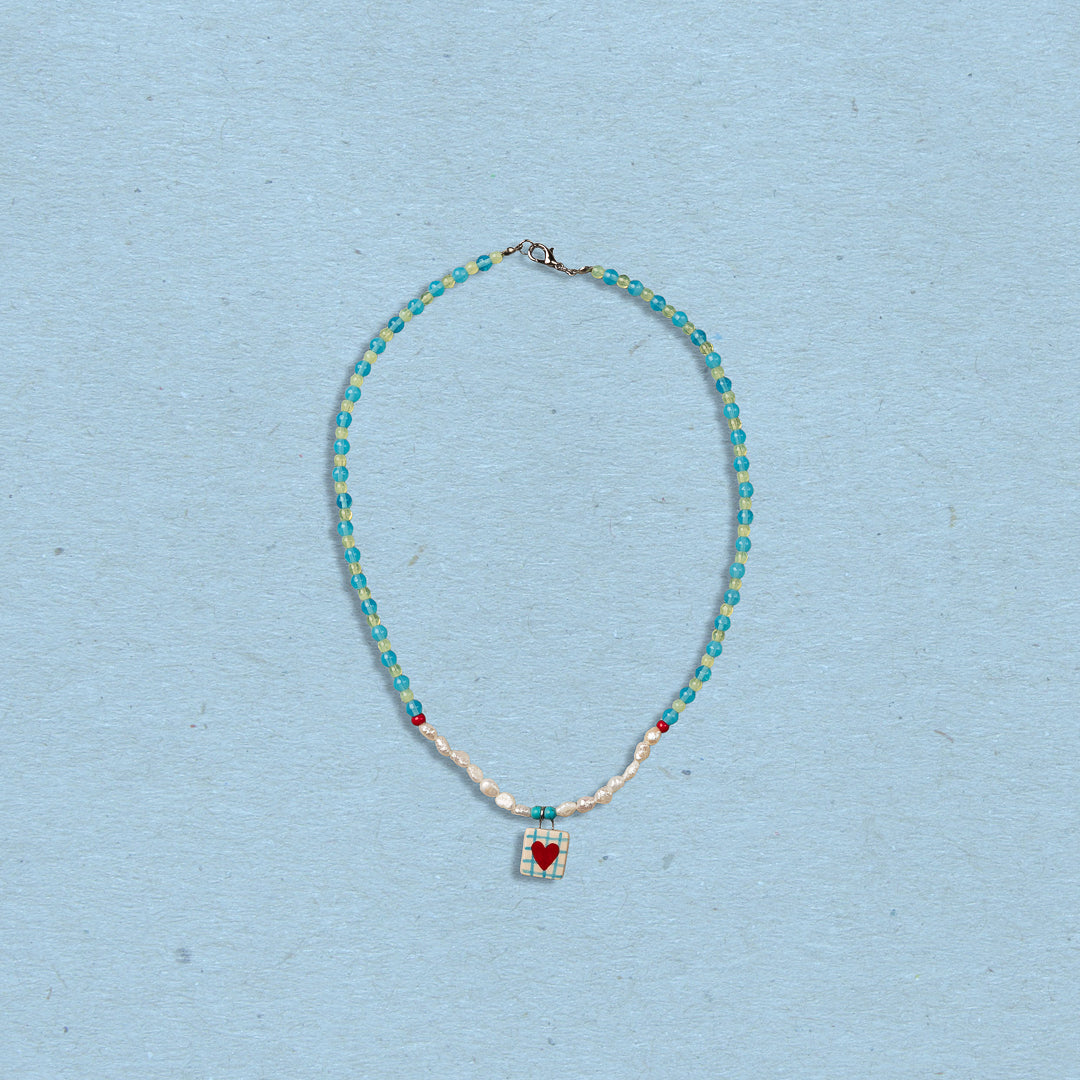 Collana di perline con ciondolo cuore