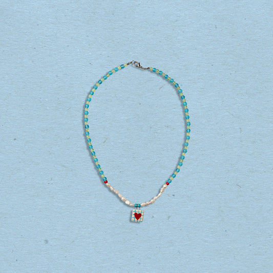 Collana di perline con ciondolo cuore
