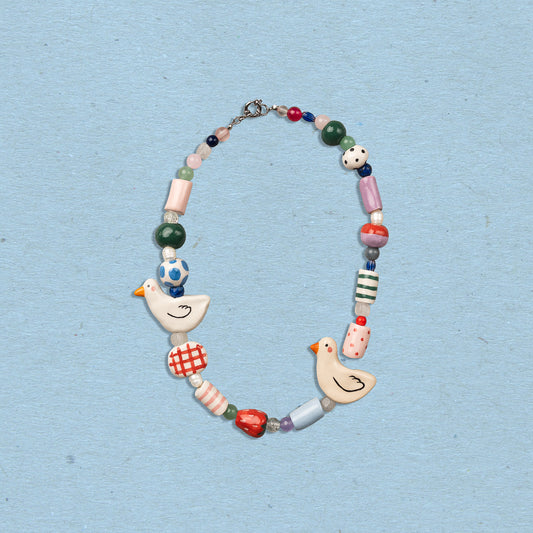 Collana con perline in ceramica e paperelle