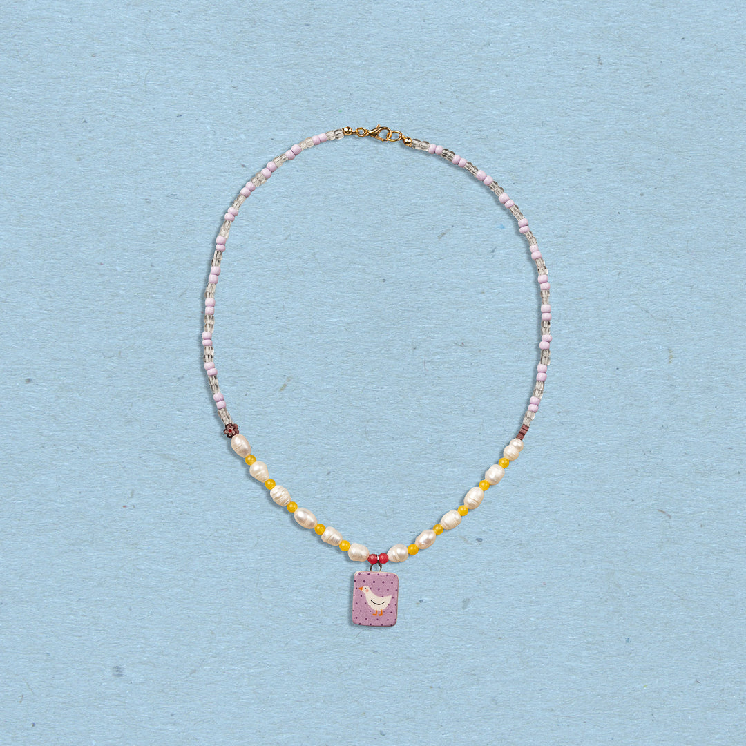 Collana con perle e ciondolo paperella