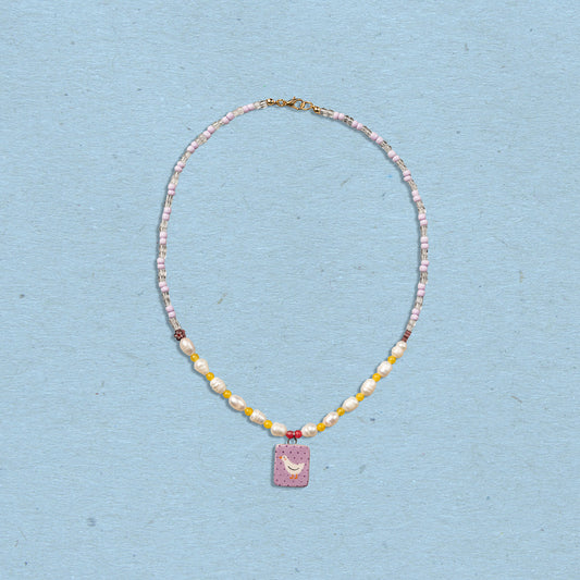 Collana con perle e ciondolo paperella