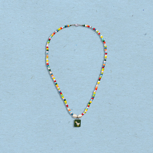 Collana di perline colorate con ciondolo paperella