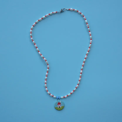 Collana di perle con ciondolo casetta
