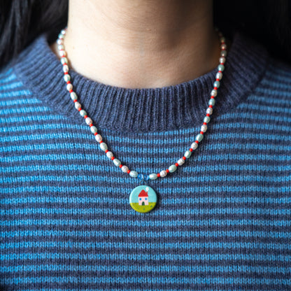 Collana di perle con ciondolo casetta