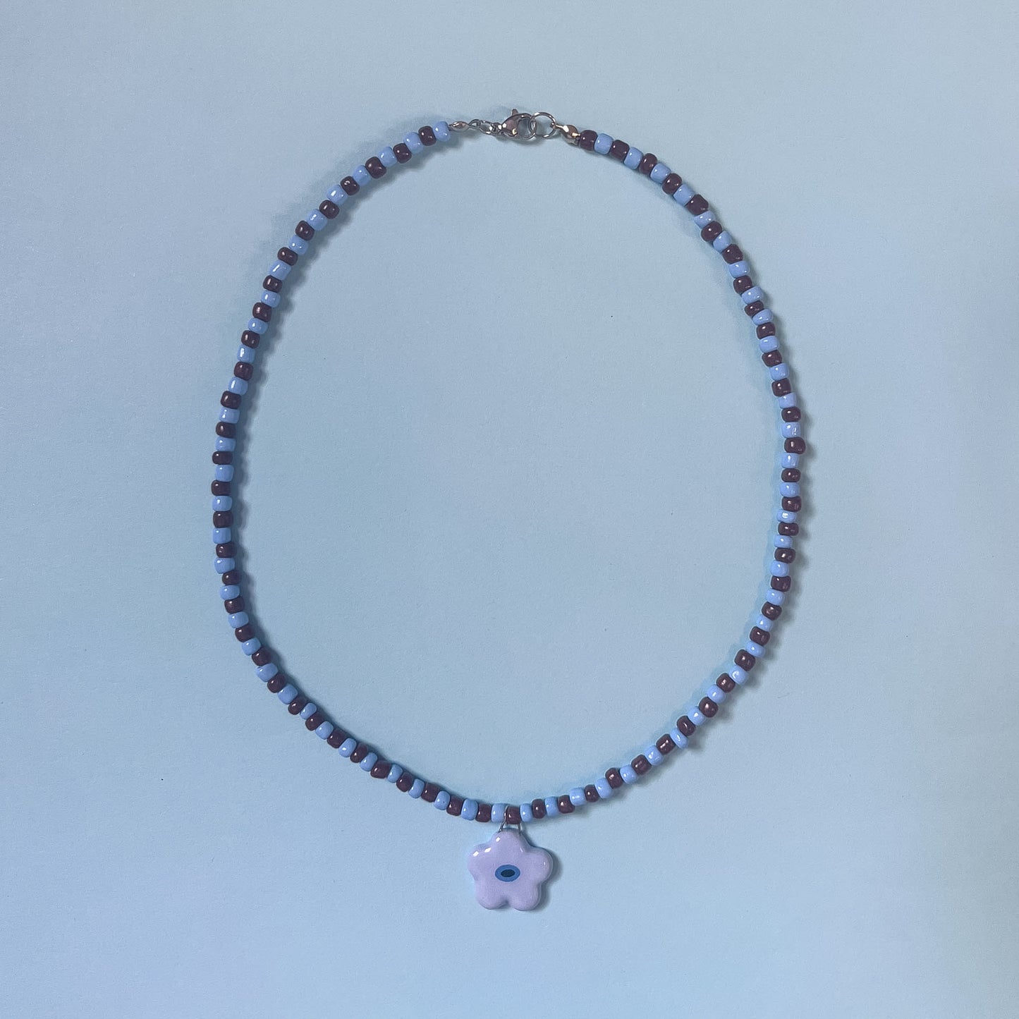 Collana con fiorellino azzurro