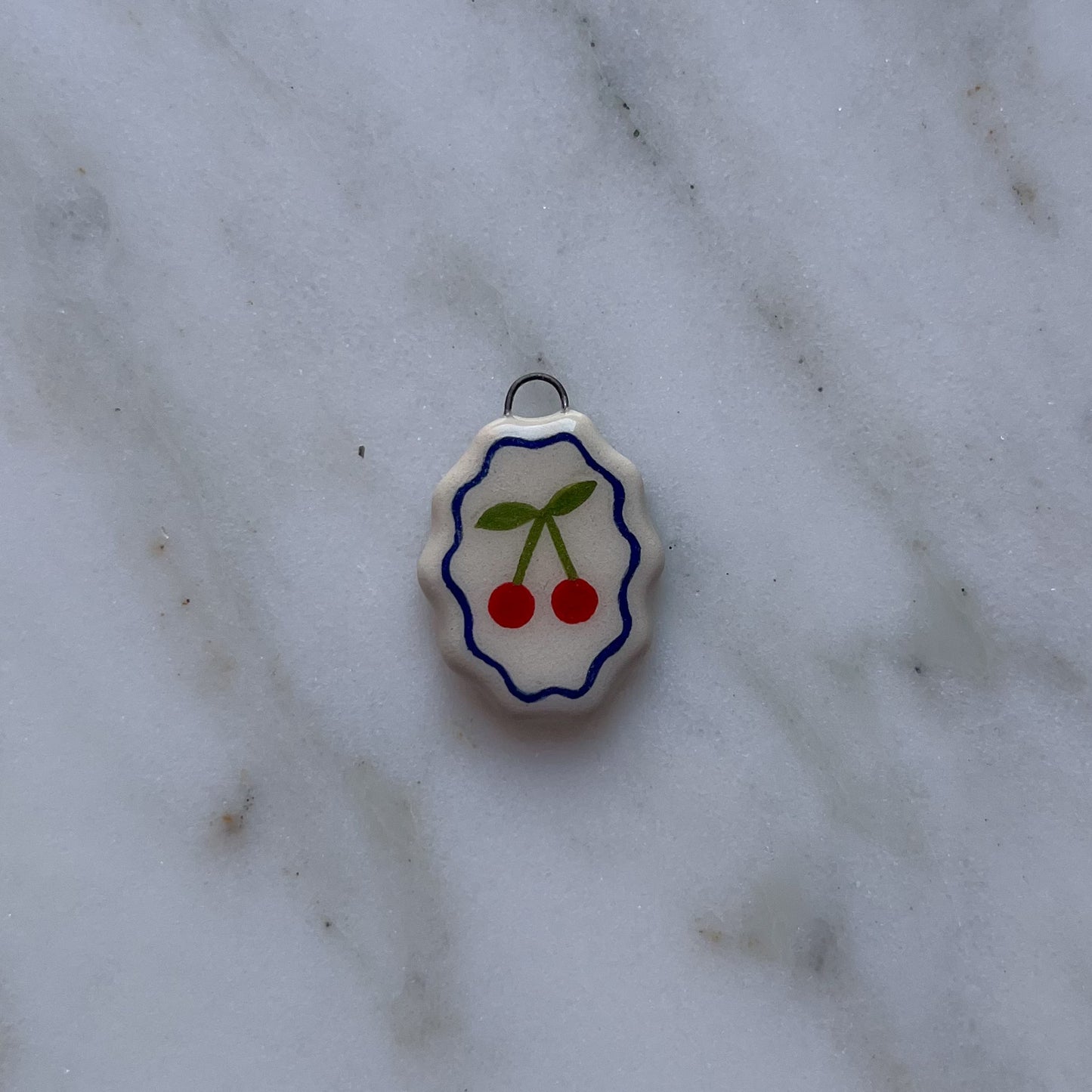 Medagliette ovali con bordo ondulato
