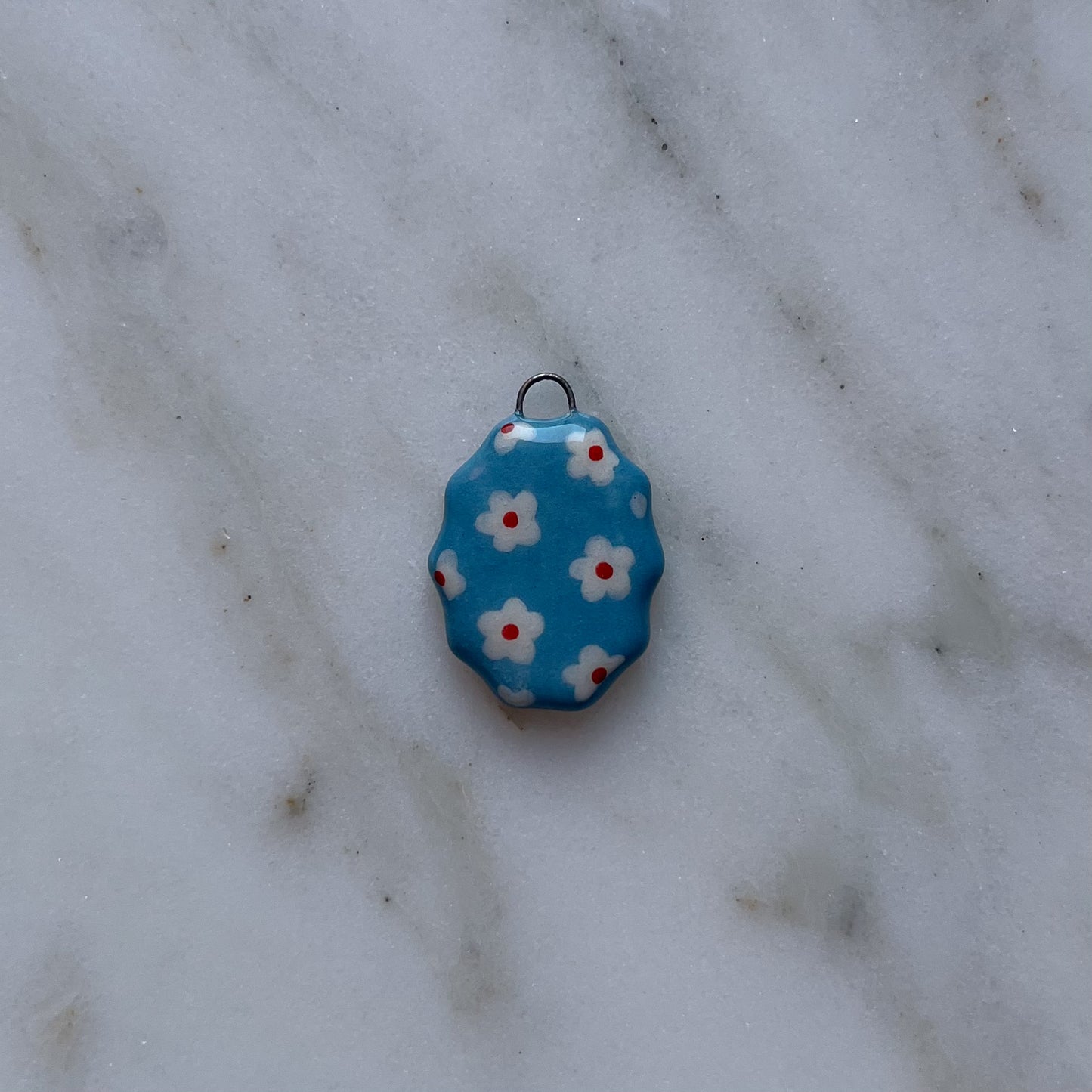 Medagliette ovali con bordo ondulato