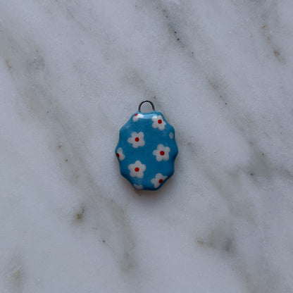 Medagliette ovali con bordo ondulato