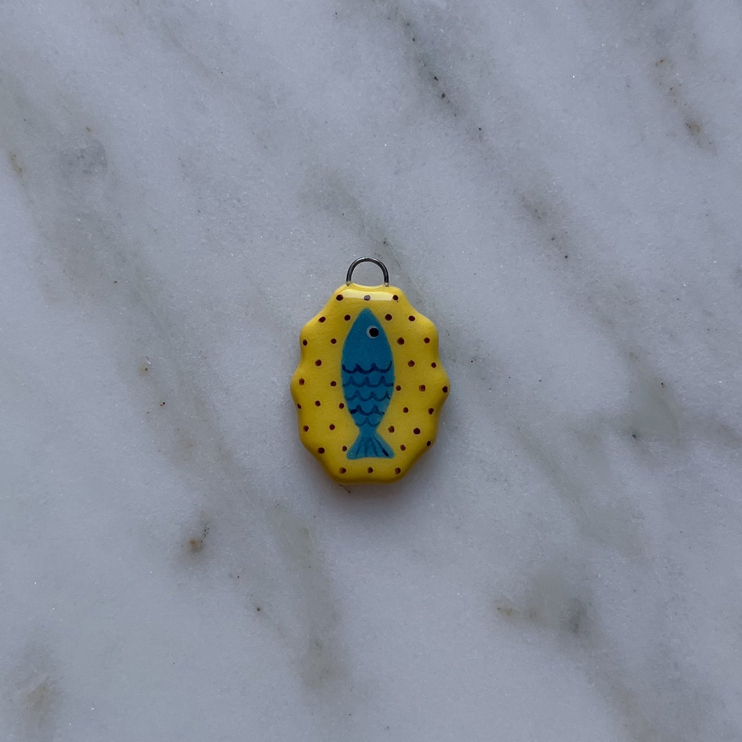 Medagliette ovali con bordo ondulato