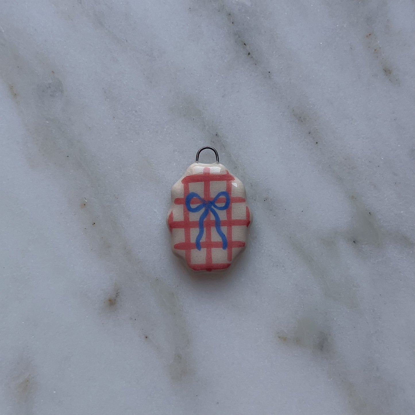 Medagliette ovali con bordo ondulato