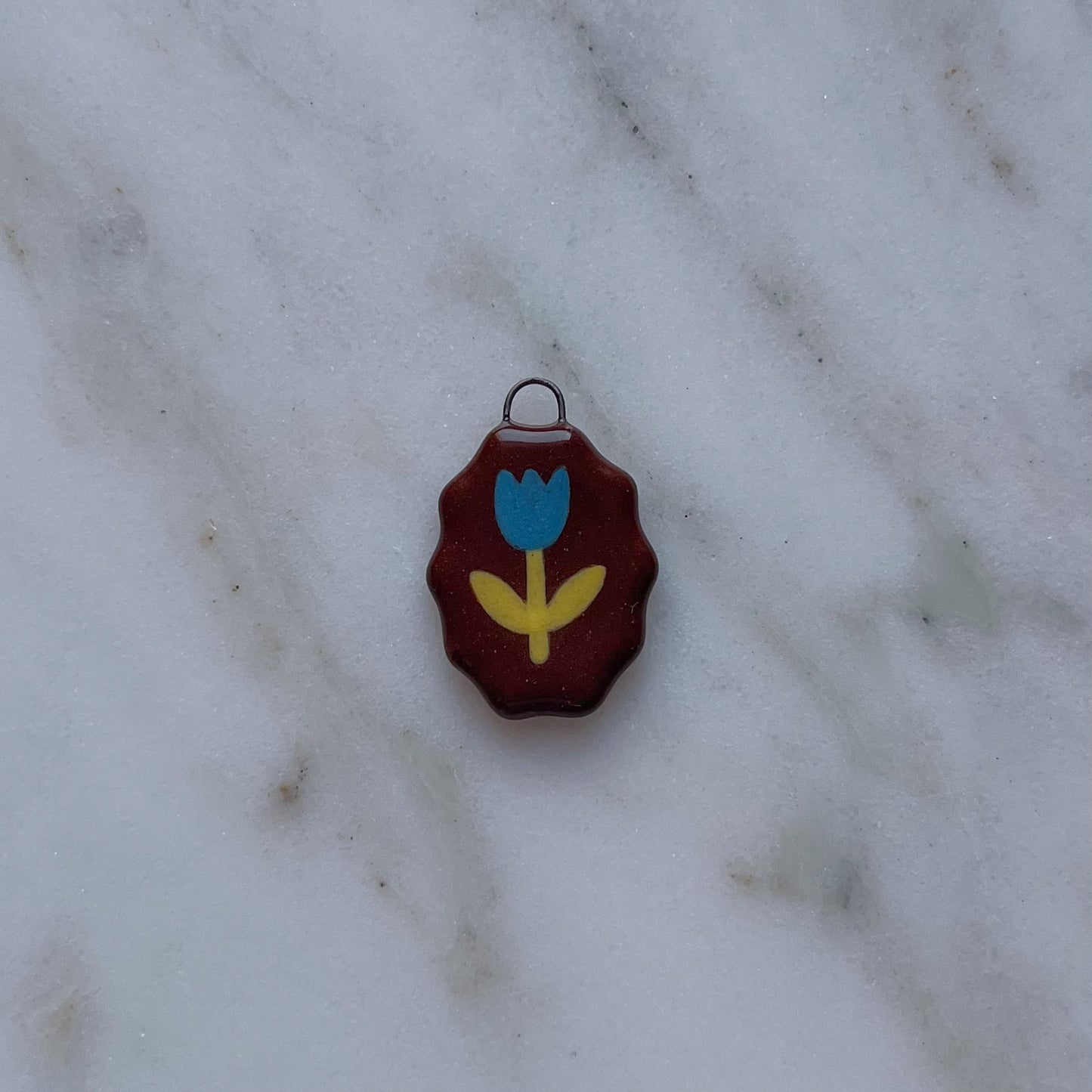 Medagliette ovali con bordo ondulato