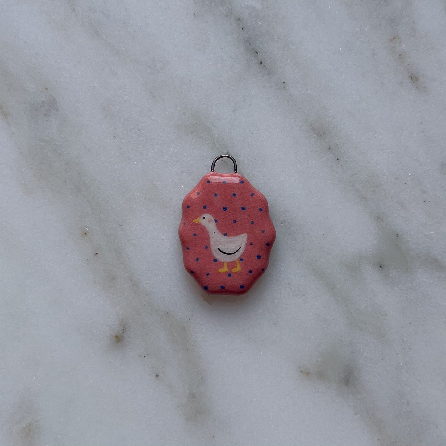 Medagliette ovali con bordo ondulato