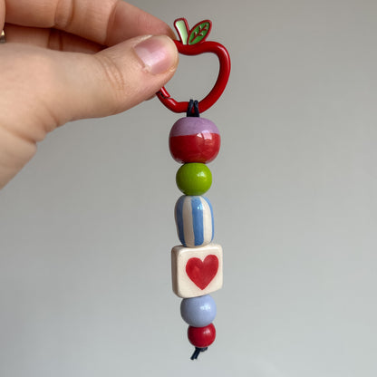 Bag charms con perline in ceramica