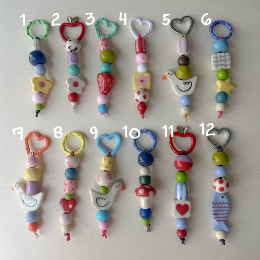 Bag charms con perline in ceramica
