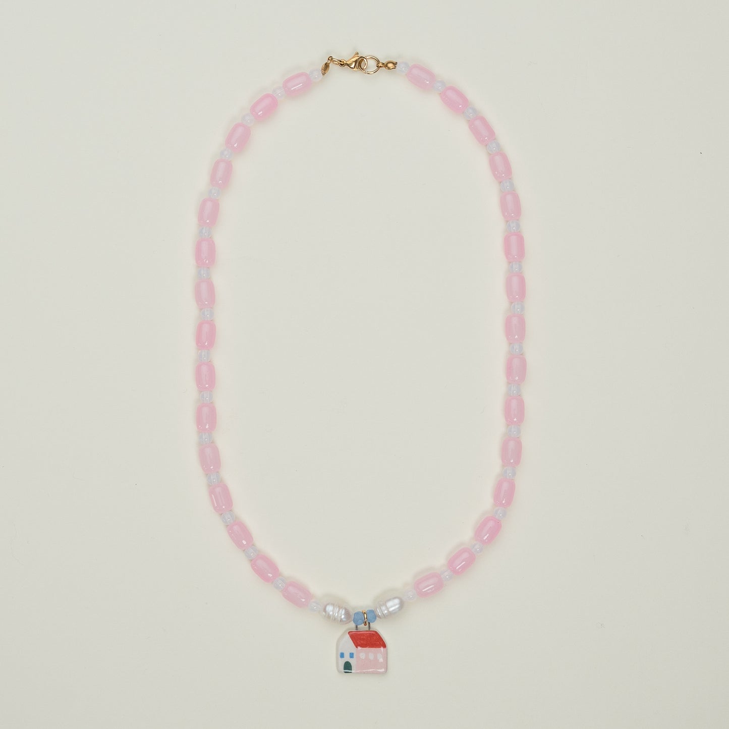 Collana rosa con ciondolo casetta