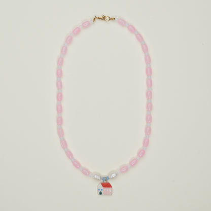 Collana rosa con ciondolo casetta