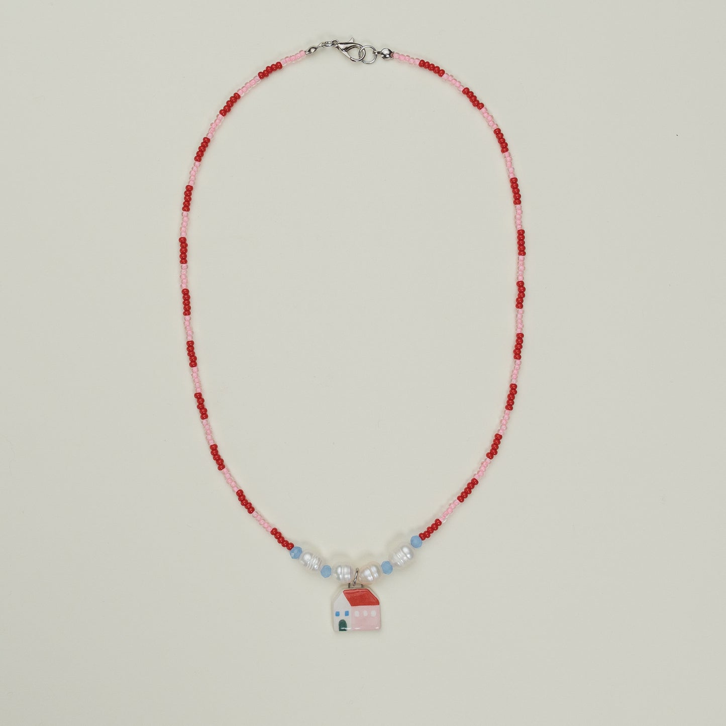 Collanina con ciondolo casetta