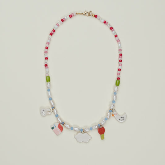 Collana con perle e mix ciondoli