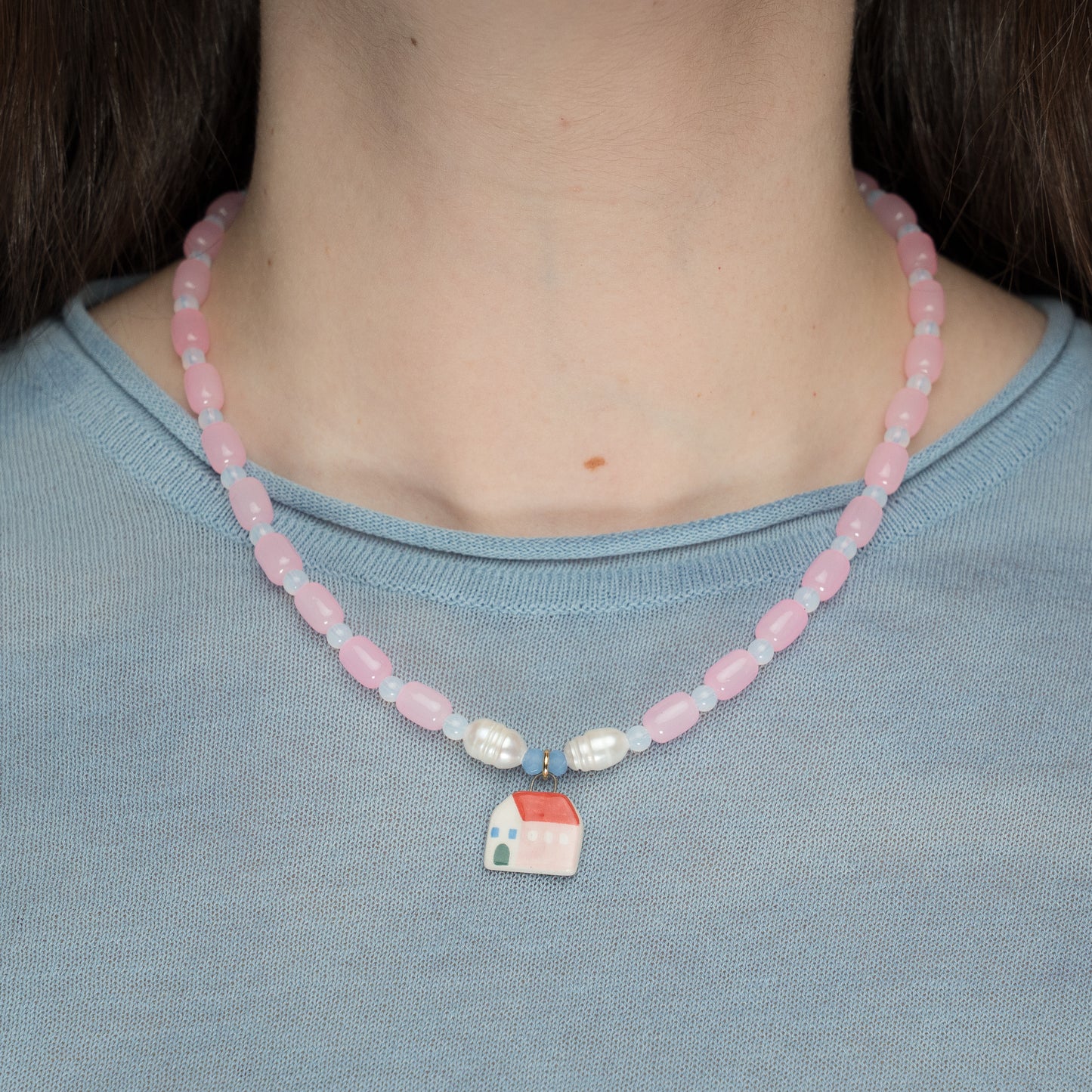 Collana rosa con ciondolo casetta