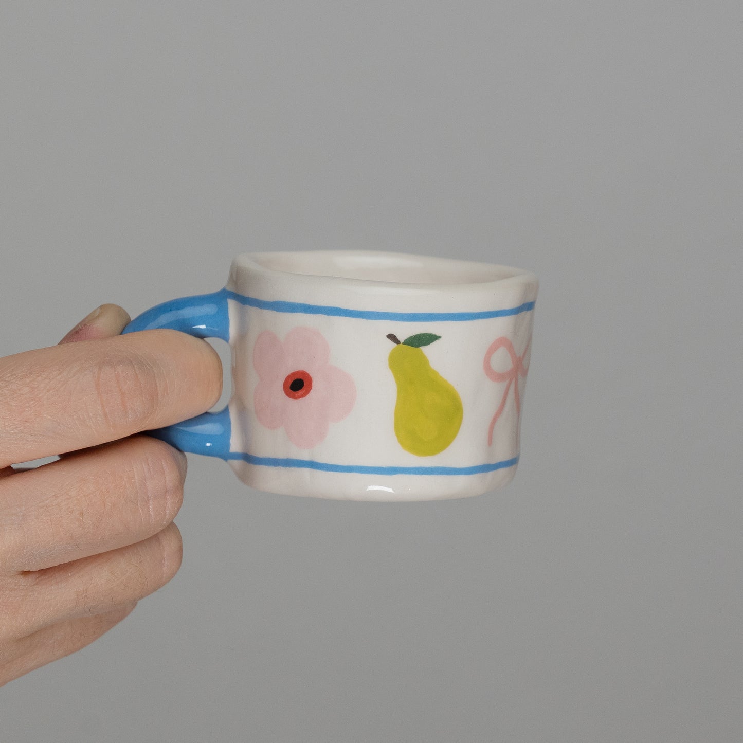 Tazzina con disegni e manico azzurro