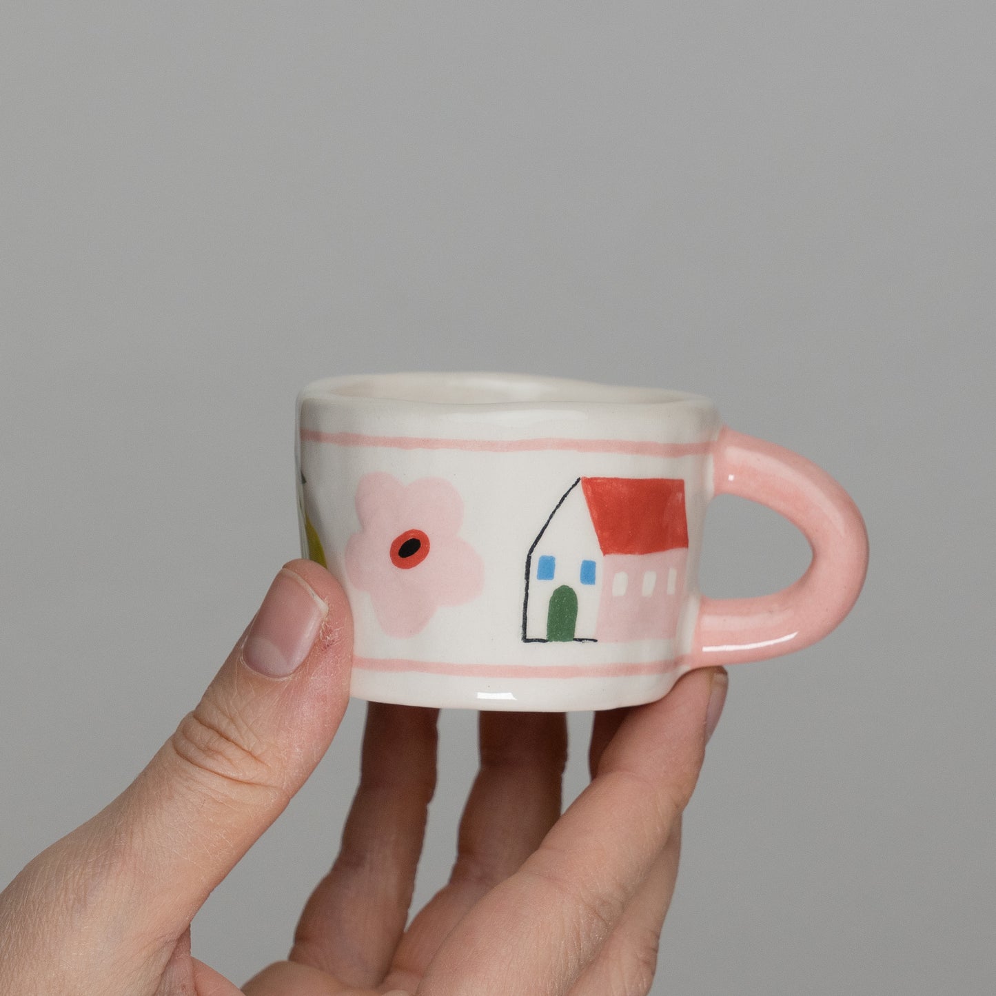 Tazzina con disegni e manico rosa