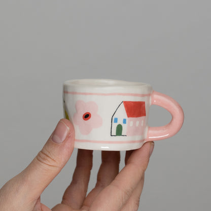 Tazzina con disegni e manico rosa