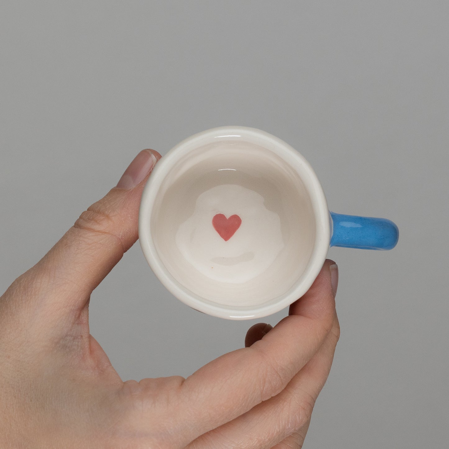 Tazzina con disegni e manico azzurro