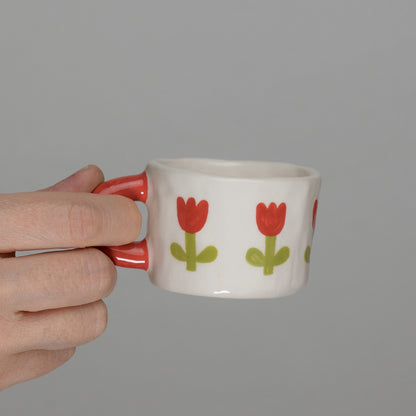 Tazzina con tulipani e manico rosso